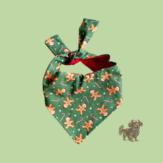 Green dog bandana with gingerbread man pattern on a light green background
