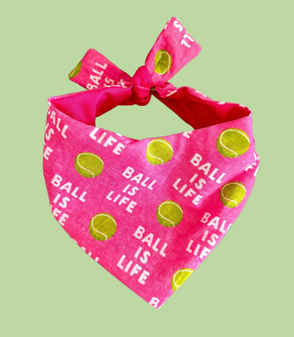 Pink bandana with 'Ball is Life' text and tennis ball graphics on a gray background